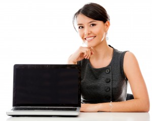 Business woman with a laptop facing the camera - isolated over white